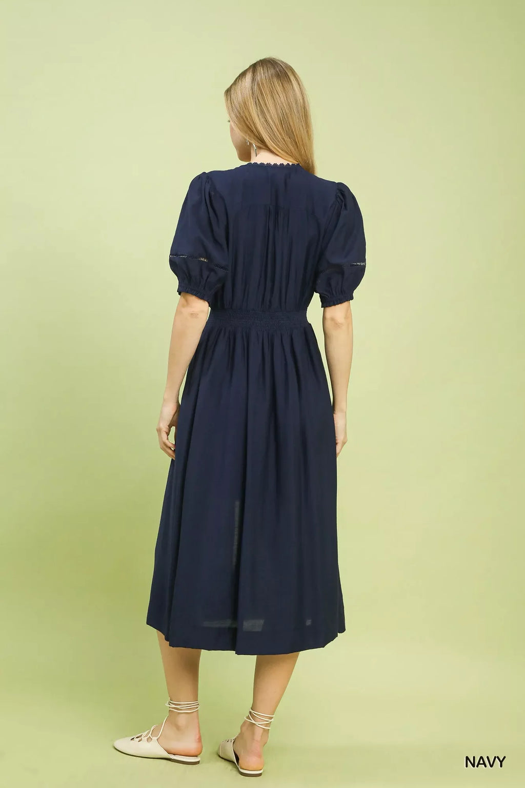 Umgee Zip-Front Smocked Waist Midi Dress is a chic and stylish piece for any occasion.
