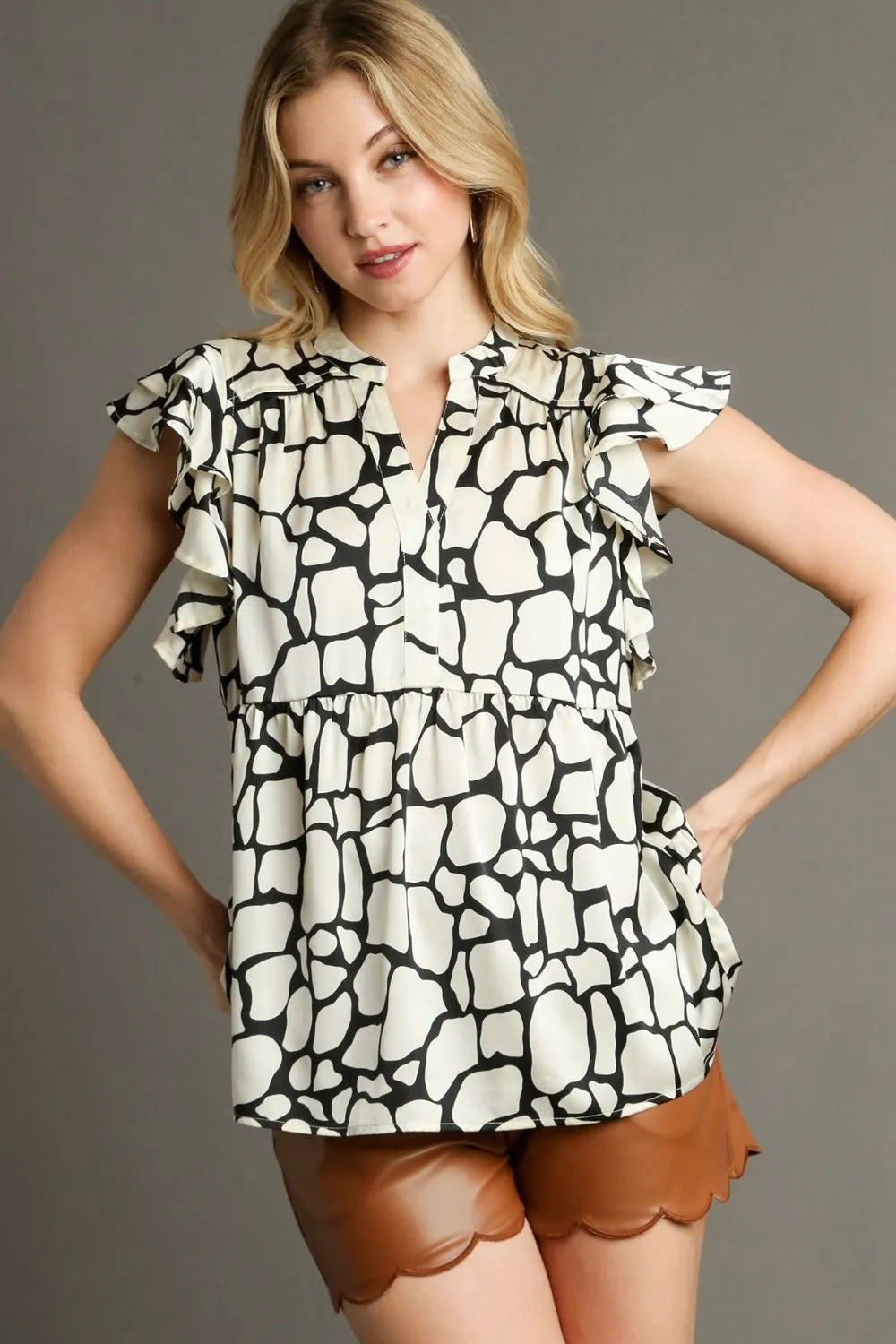 Umgee Full Size Two Tone Animal Print Notched Ruffle Cap Sleeve Blouse Plus Size
